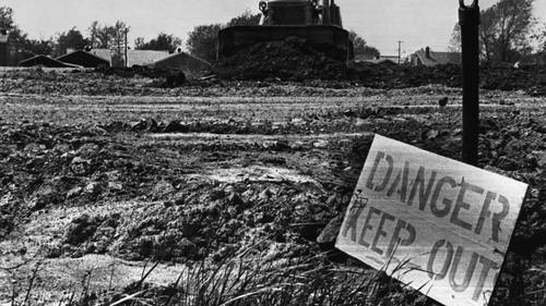 22 May 1980, Niagara Falls, New York State, USA --- Original caption: Clean up efforts have started in the Love Canal. Signs have been posted all over the area with a special warning to all residents to KEEP OUT. Most of the residents have taken that advice and have moved to Motels following a press statement yesterday in Washington. --- Image by © Bettmann/CORBIS